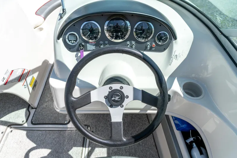 Slide: The Image of Steering wheel and dashboard of 2008 Sea Ray 205 Sport boat. - 17