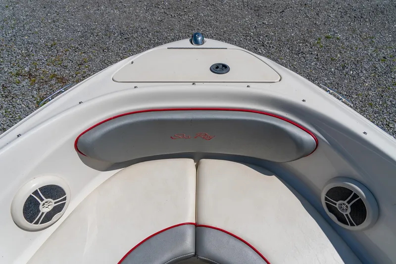 Slide: The Image of 2008 Sea Ray 205 Sport boat bow with cushioned seating and speakers. - 21
