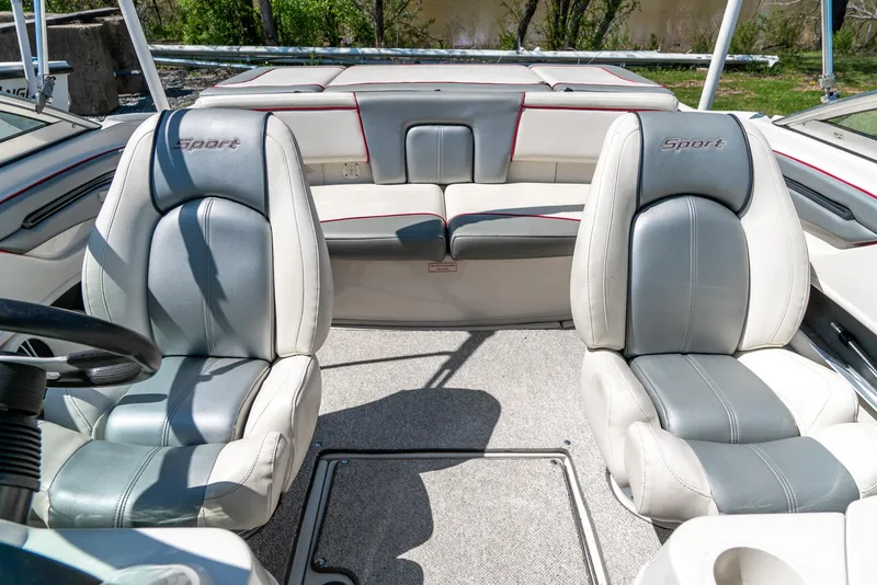 Slide: The Image of 2008 Sea Ray 205 Sport boat interior with gray and white seating. - 25