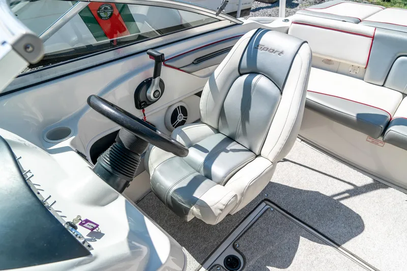 Slide: The Image of 2008 Sea Ray 205 Sport boat interior with steering wheel and seating. - 26