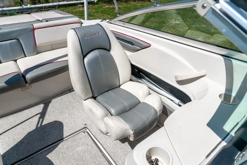 Slide: The Image of 2008 Sea Ray 205 Sport boat interior with gray and white seating. - 27
