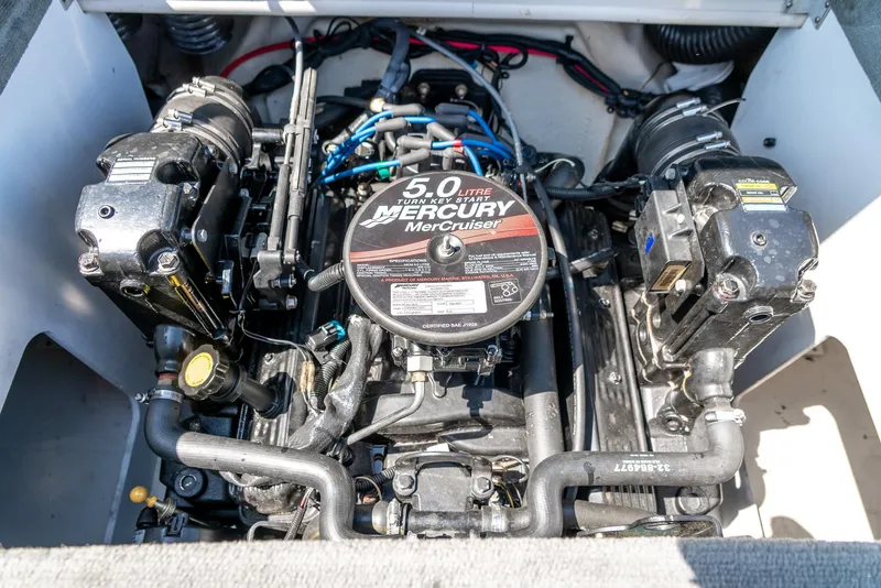 Slide: The Image of Engine of 2008 Sea Ray 205 Sport boat, featuring a 5.0L Mercury MerCruiser. - 32