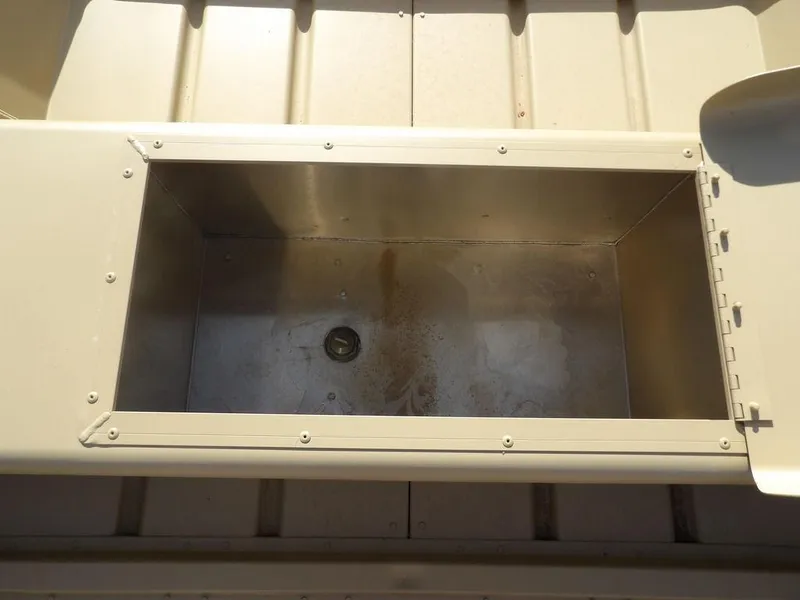 Slide: The Image of Open storage compartment in 2025 Crestliner 1648M CR Jon boat. - 13