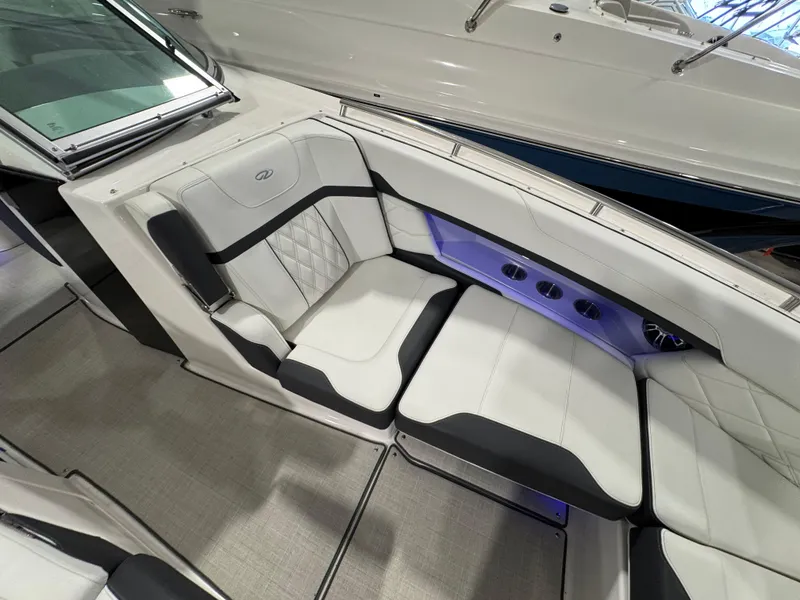 Slide: The Image of 2023 Regal 3300 boat interior with white and black seating, modern design. - 16