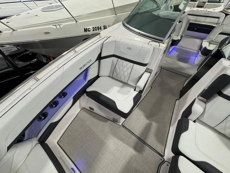Slide: The Image of 2023 Regal 3300 boat interior with luxurious seating and ambient lighting. - 18
