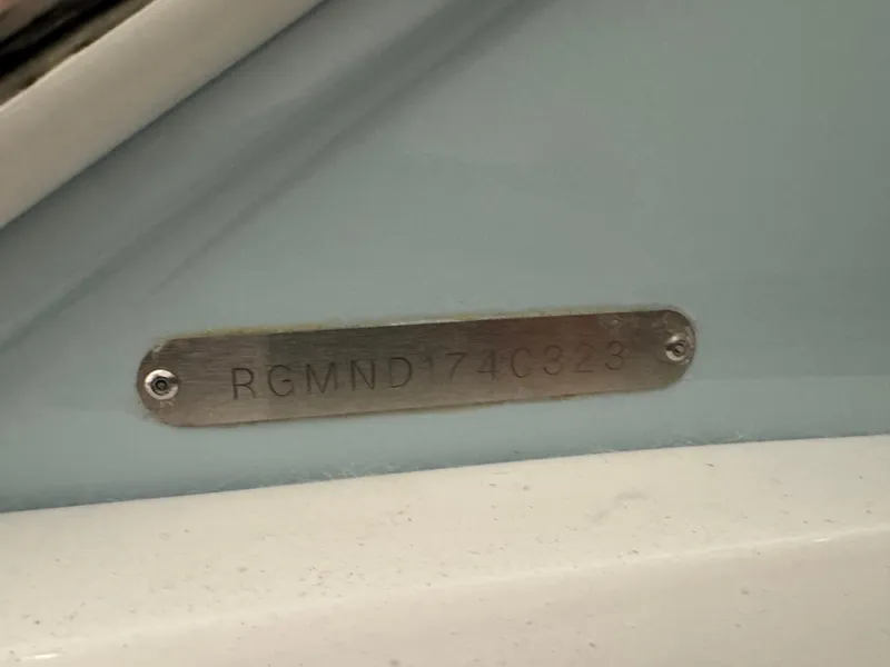 Slide: The Image of 2023 Regal 3300 boat identification plate with serial number RGMND174C323. - 23