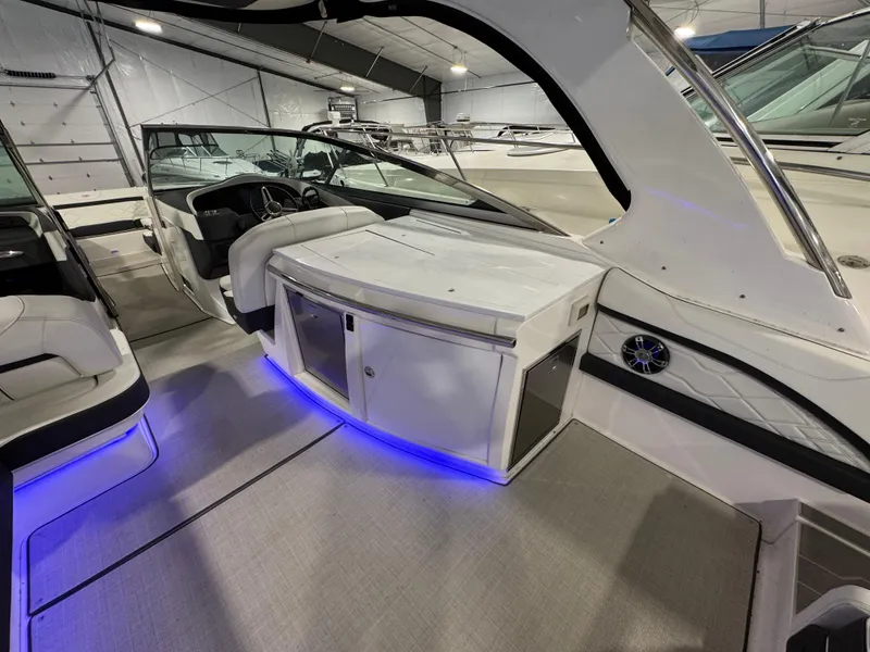 Slide: The Image of 2023 Regal 3300 boat interior with modern seating and blue LED lighting. - 5