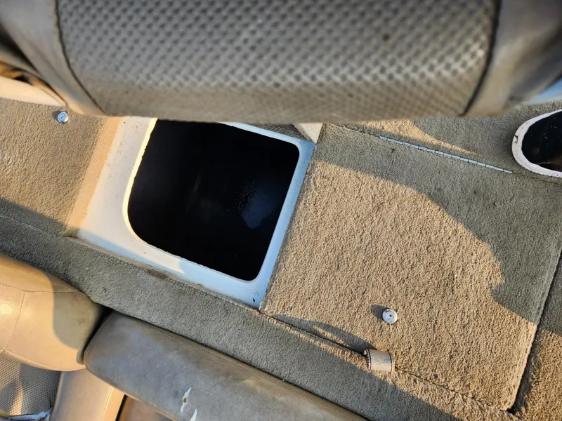 Slide: The Image of Interior view of a 2001 Nitro 896 DC boat, featuring a storage compartment. - 10