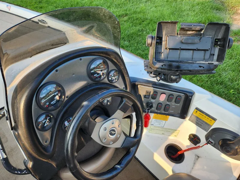 Slide: The Image of Steering console of a 2001 Nitro 896 DC boat with gauges and controls. - 11