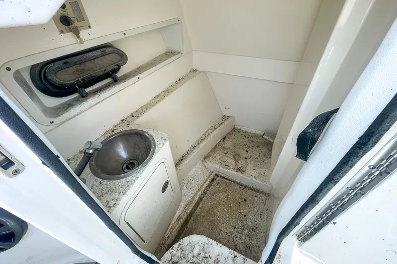 Slide: The Image of 2019 Sea Ray 270 Sundeck SDX interior with sink and window. - 16