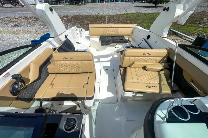 Slide: The Image of 2019 Sea Ray 270 Sundeck SDX interior with tan seating and modern design. - 18