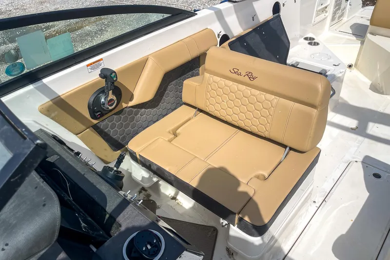 Slide: The Image of 2019 Sea Ray 270 Sundeck SDX interior with tan seating and modern design. - 19