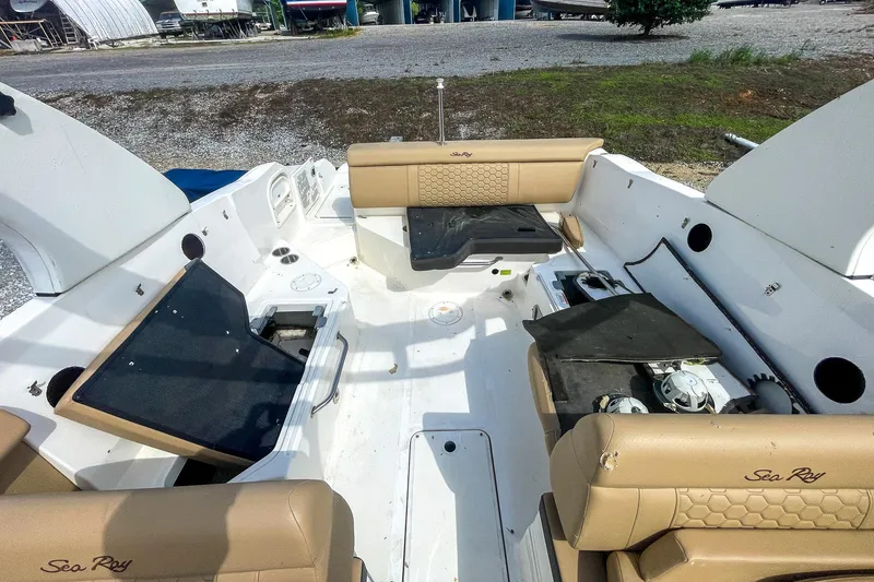 Slide: The Image of 2019 Sea Ray 270 Sundeck SDX interior with tan seating and open deck layout. - 21