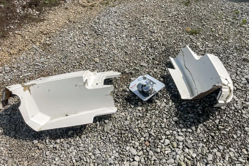 Slide: The Image of Broken parts of a 2019 Sea Ray 270 Sundeck SDX on gravel. - 25