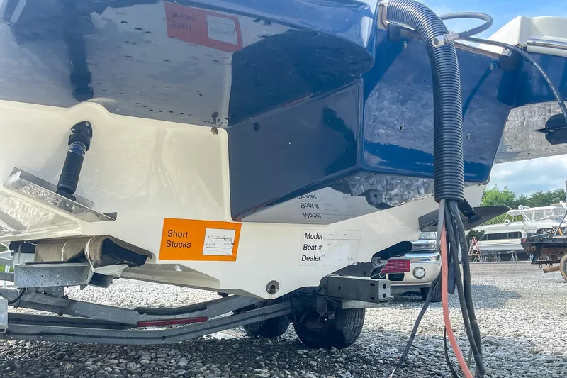 Slide: The Image of 2019 Sea Ray 270 Sundeck SDX boat on trailer, rear view, outdoor setting. - 27