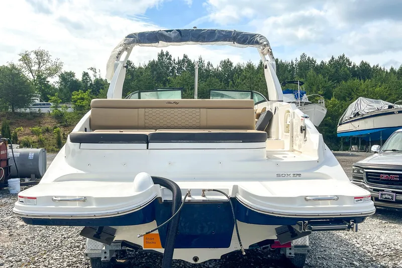 Slide: The Image of 2019 Sea Ray 270 Sundeck SDX boat, rear view, parked outdoors. - 6