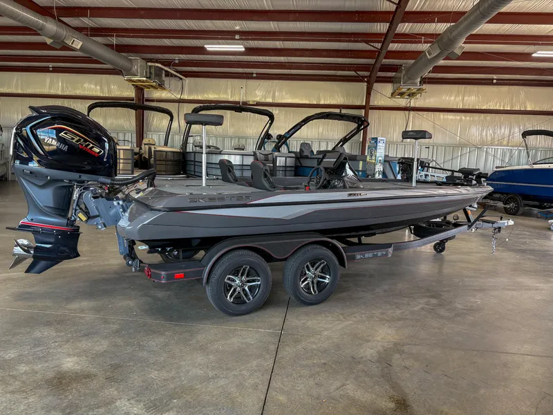 Slide: The Image of 2025 Skeeter ZXR 19 boat in a warehouse, featuring a sleek design and powerful engine. - 12