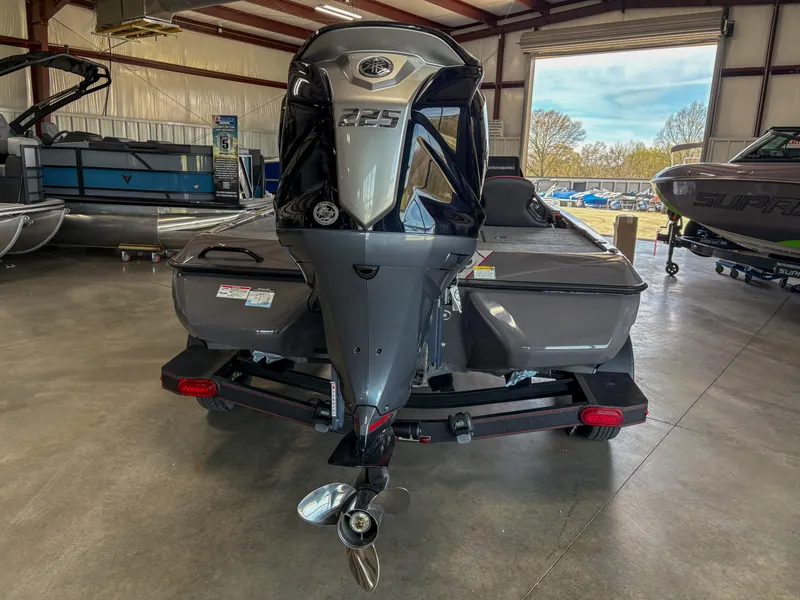 Slide: The Image of Skeeter ZXR 19 boat, 2025 model, in a showroom with visible outboard motor. - 13