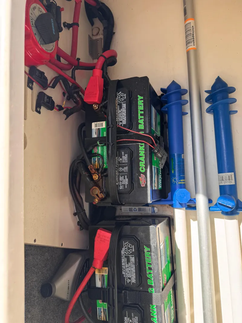 Slide: The Image of Battery compartment of a 2012 Sea Ray 200 SD boat with wiring and accessories. - 13