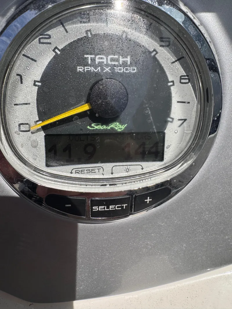 Slide: The Image of Close-up of a Sea Ray 200 SD 2012 tachometer displaying RPM and hours. - 4