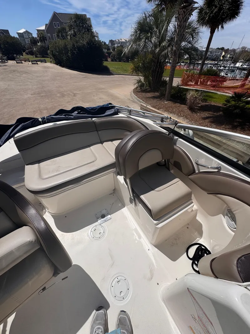 Slide: The Image of Interior of a 2012 Sea Ray 200 SD boat with seating and open deck. - 6