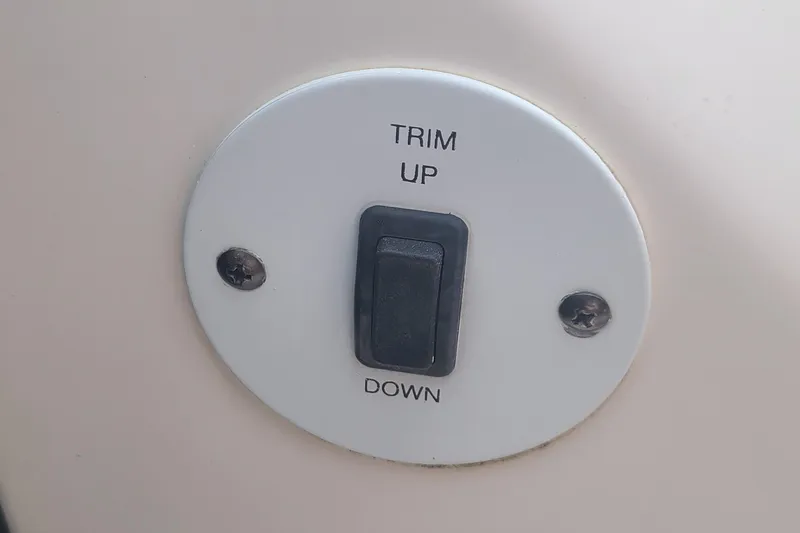 Slide: The Image of Switch for trim control on 2005 Chaparral 264 Sunesta boat. - 16