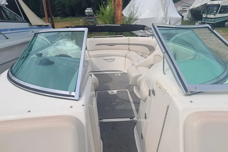 Slide: The Image of 2005 Chaparral 264 Sunesta boat interior with seating and windshield. - 3
