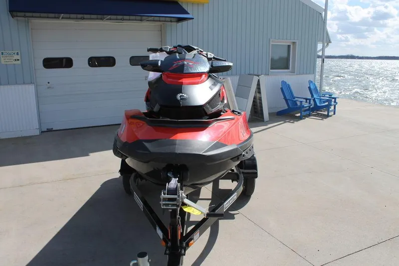 Slide: The Image of 2016 Sea-Doo RXT-X aS 260 jet ski on trailer by waterfront. - 4