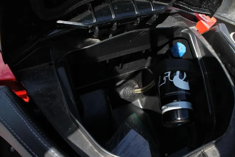 Slide: The Image of Storage compartment of 2016 Sea-Doo RXT-X aS 260 with a bottle inside. - 5