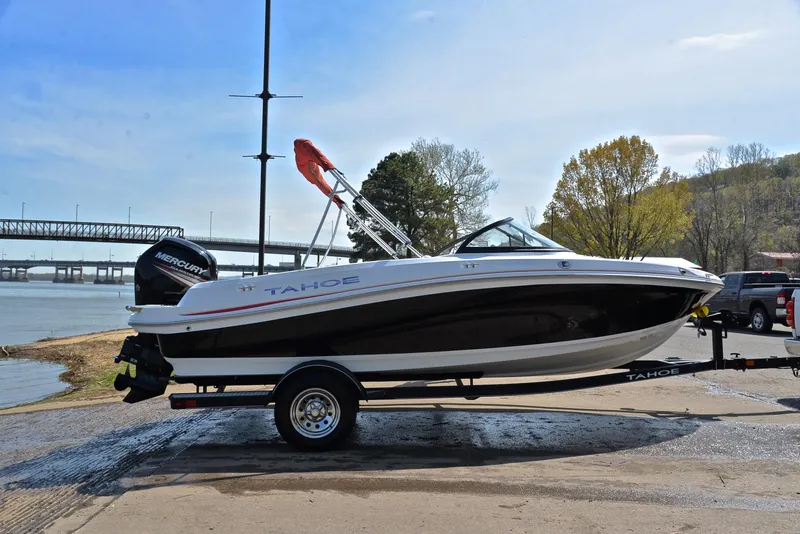 Slide: The Image of 2018 Tahoe 550 TS boat on trailer by riverside, ready for launch. - 15
