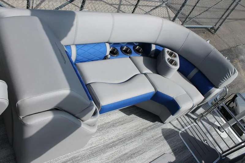 Slide: The Image of 2025 Bennington L Quad Bench 25 LFB with gray and blue seating, cup holders, and modern design. - 11