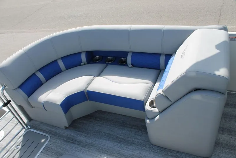 Slide: The Image of 2025 Bennington L Quad Bench 25 LFB with blue and gray seating on a boat deck. - 13
