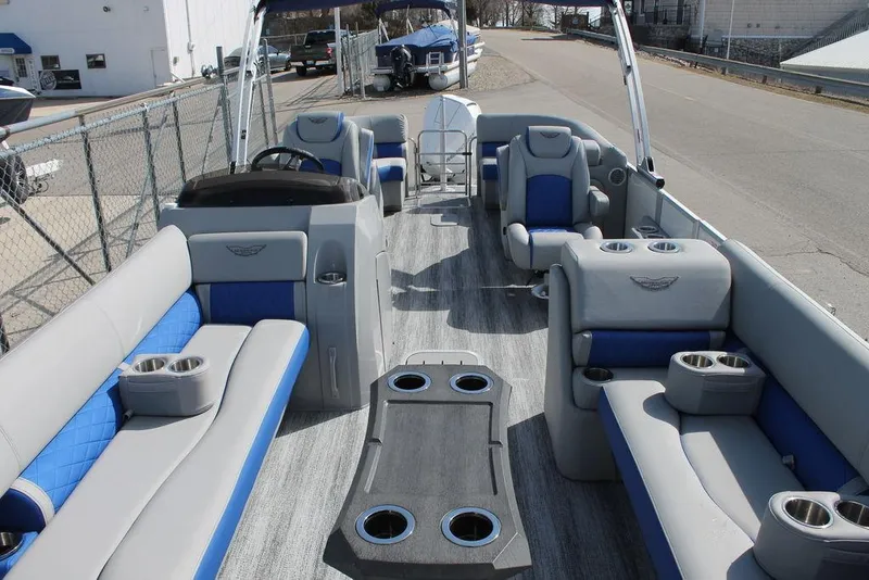 Slide: The Image of 2025 Bennington L Quad Bench 25 LFB pontoon boat with spacious seating and modern design. - 4