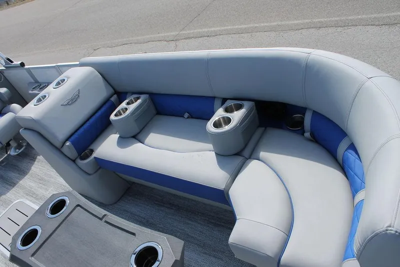 Slide: The Image of 2025 Bennington L Quad Bench 25 LFB with gray and blue seating, featuring multiple cup holders. - 7