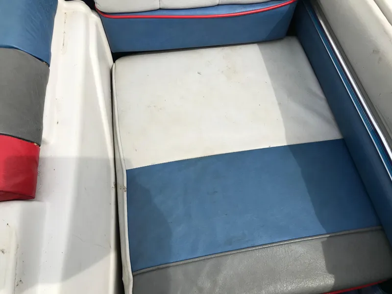 Slide: The Image of 1987 Bayliner 1950 Capri boat seat with blue, white, and gray upholstery. - 14
