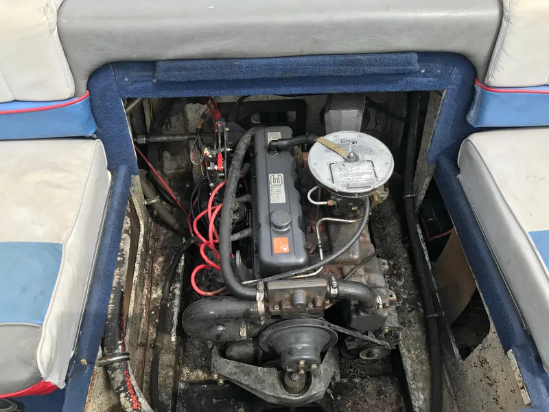 Slide: The Image of 1987 Bayliner 1950 Capri engine compartment with visible motor and wiring. - 5