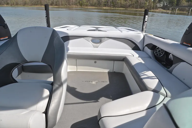 Slide: The Image of Interior of 2012 Centurion ELITE C4 boat with gray seating and lake view. - 22