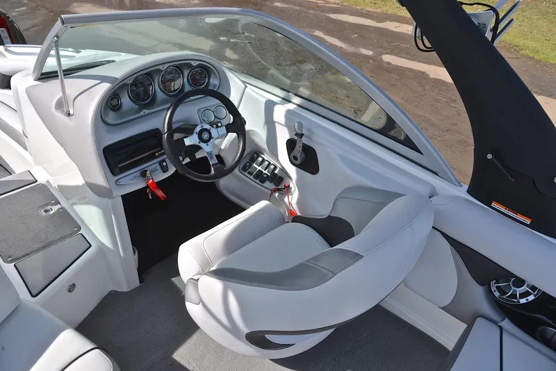 Slide: The Image of Interior of 2012 Centurion ELITE C4 boat with steering wheel and dashboard controls. - 24