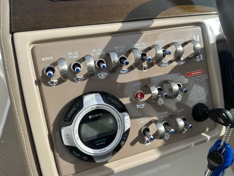 Slide: The Image of Control panel of a 2011 Sea Ray 250 SLX boat with Sony marine audio system. - 21
