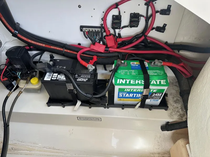 Slide: The Image of Marine battery setup in a 2011 Sea Ray 250 SLX boat, featuring Interstate batteries. - 26
