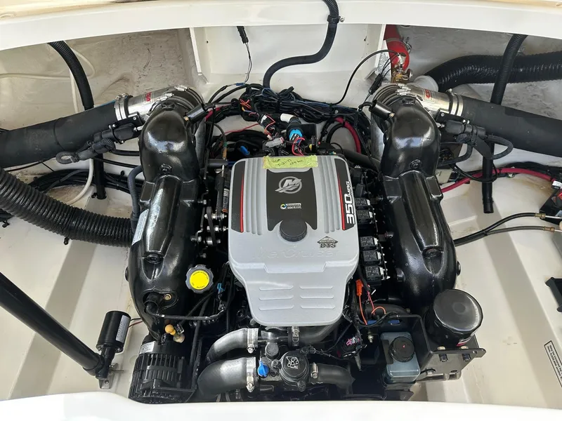 Slide: The Image of Engine compartment of a 2011 Sea Ray 250 SLX boat, featuring a 350 MAG engine. - 29