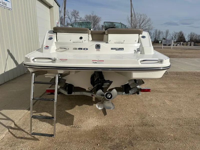 Slide: The Image of 2011 Sea Ray 250 SLX boat rear view with ladder and propeller. - 4