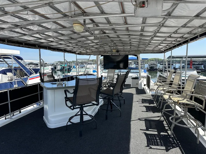 Slide: The Image of Houseboat deck with bar and seating, Lakeview 16x68, 2006 model, docked at marina. - 15