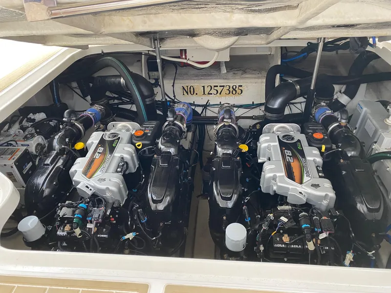 Slide: The Image of Luxurious cabin interior of 2011 Sea Ray 370 Sundancer with cozy bed and wooden finish. - 22