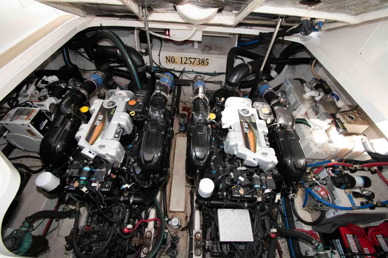 Slide: The Image of Engine room of 2011 Sea Ray 370 Sundancer with twin engines and mechanical components. - 28