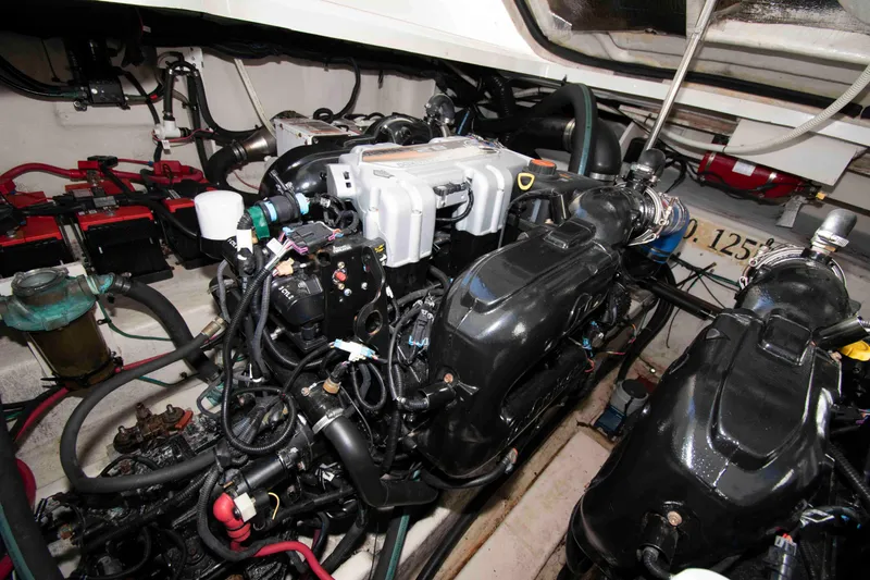 Slide: The Image of Engine room of 2011 Sea Ray 370 Sundancer with visible components and wiring. - 29