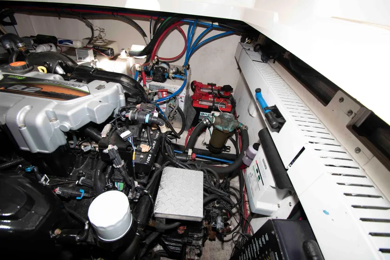 Slide: The Image of Engine compartment of 2011 Sea Ray 370 Sundancer with visible components and wiring. - 30