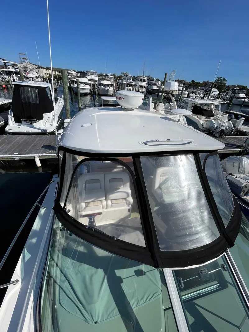 Slide: The Image of Cockpit of 2011 Sea Ray 370 Sundancer with dual seats and control panel. - 9