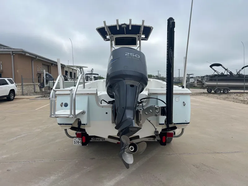 Slide: The Image of 2009 Sea Hunt BX24 boat with Yamaha 250 engine, parked in a lot. - 12