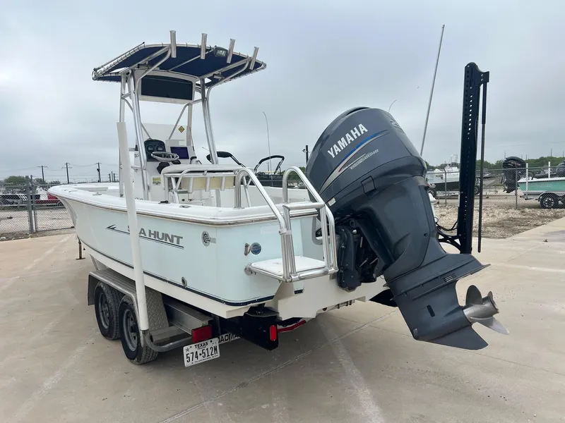 Slide: The Image of 2009 Sea Hunt BX24 boat with Yamaha outboard motor on trailer. - 13